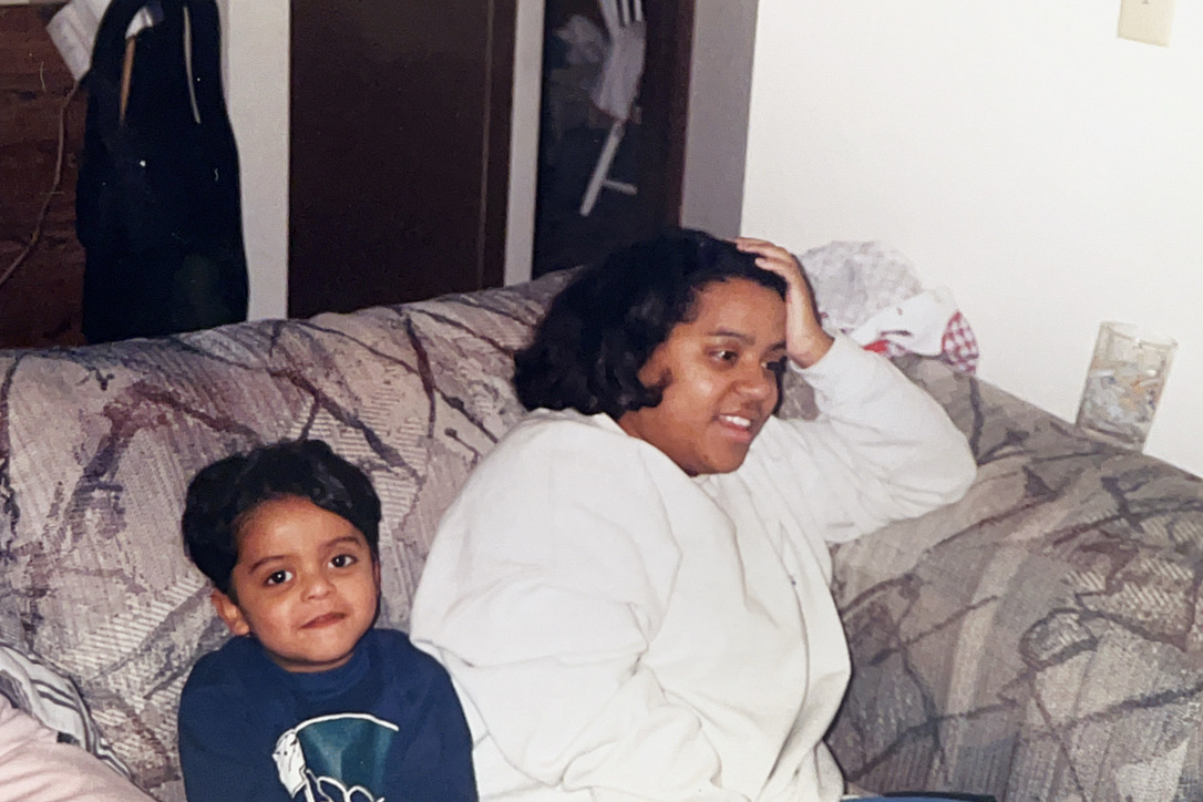 Nydia and young Estevan on bed