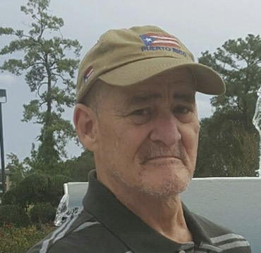 Family member with Puerto Rico cap