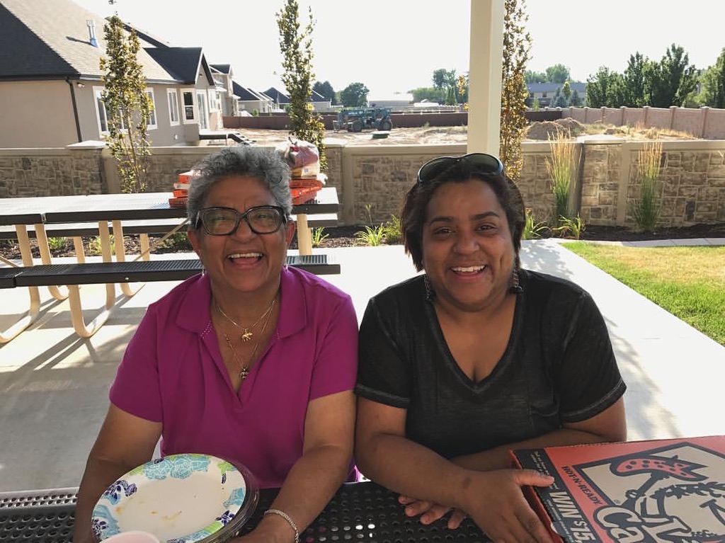 Nydia and family outdoors